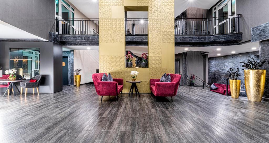 Posezení v ubytování PLAZA Premium Parkhotel Norderstedt