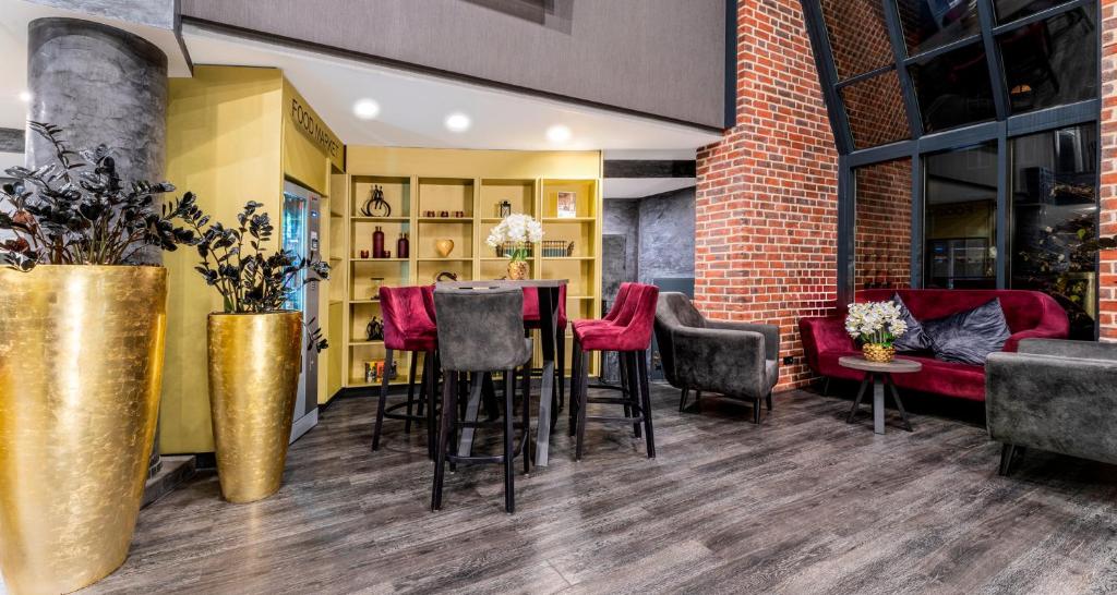 Posezení v ubytování PLAZA Premium Parkhotel Norderstedt
