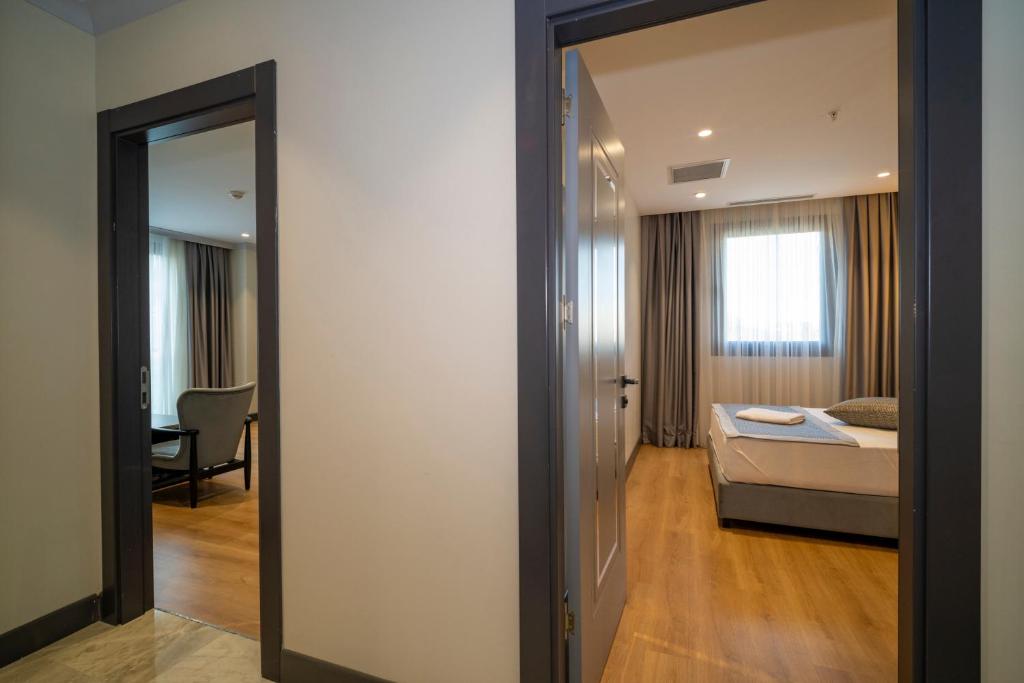 Postel nebo postele na pokoji v ubytování Rusel Park Residence