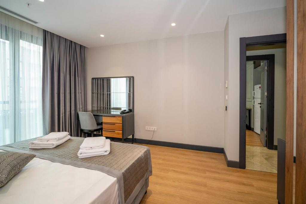 Postel nebo postele na pokoji v ubytování Rusel Park Residence