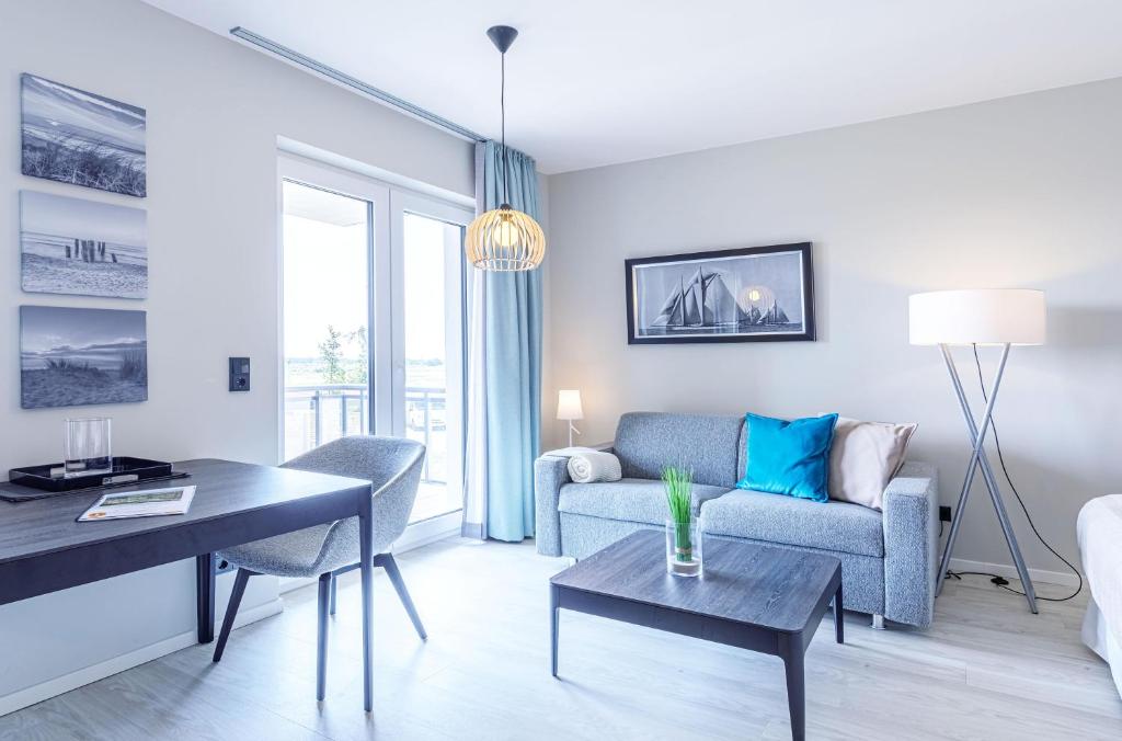 Posezení v ubytování Kleine Strandmuschel mit Südbalkon