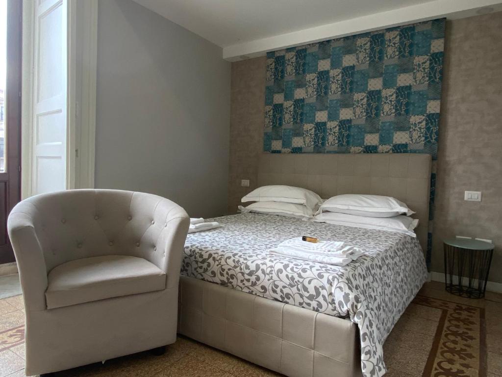Postel nebo postele na pokoji v ubytování B&B Suite Cutelli