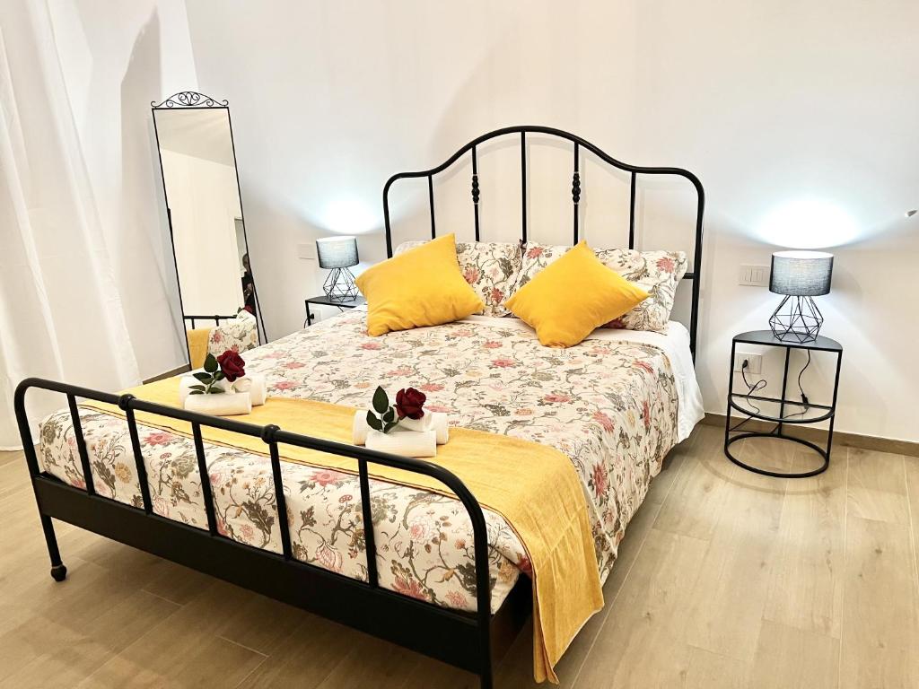 Ένα ή περισσότερα κρεβάτια σε δωμάτιο στο I Platani Home Gratis Parcheggio