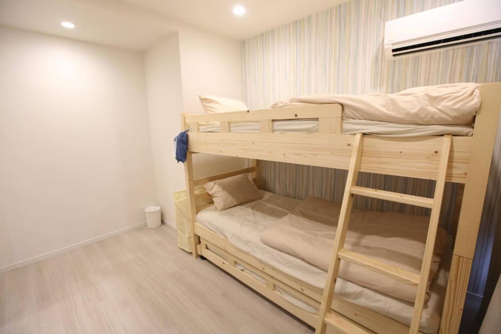 Giường trong phòng chung tại Breath of the Sea Katakai - Vacation STAY 47846v