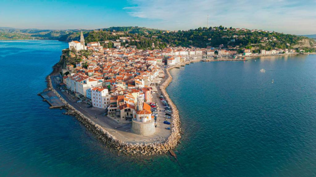 an aerial view of a town on an island in the water at Apartma Mariella in Piran