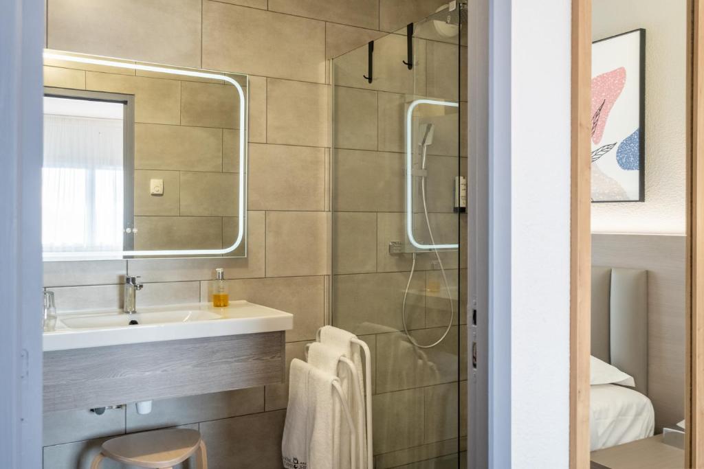 Koupelna v ubytování Hotel Tambourin