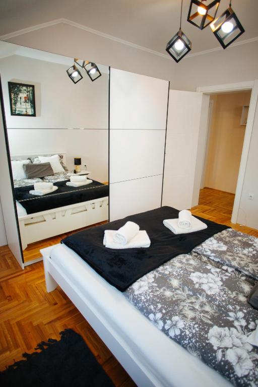 Postel nebo postele na pokoji v ubytování Queen Deluxe