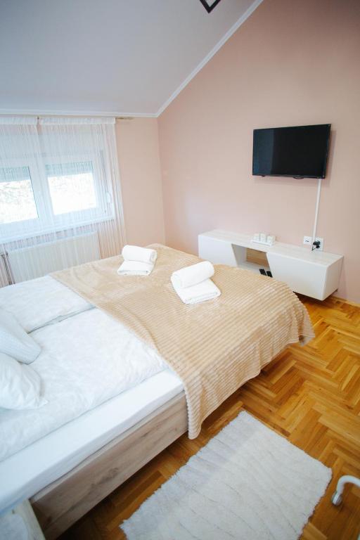 Postel nebo postele na pokoji v ubytování Queen Deluxe