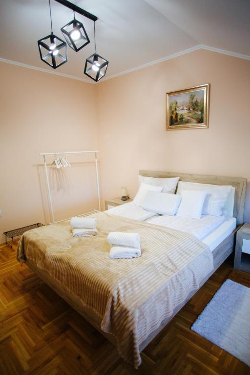Postel nebo postele na pokoji v ubytování Queen Deluxe