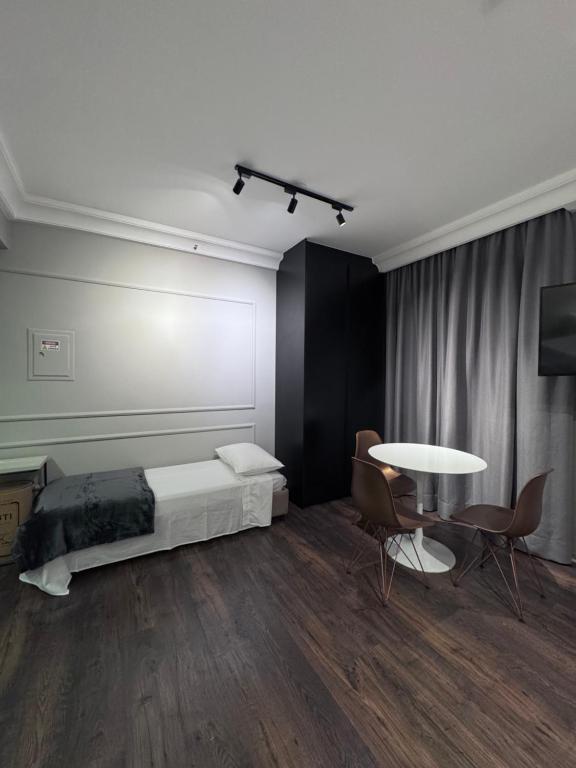 Postel nebo postele na pokoji v ubytování Flat Higienópolis Com Varanda