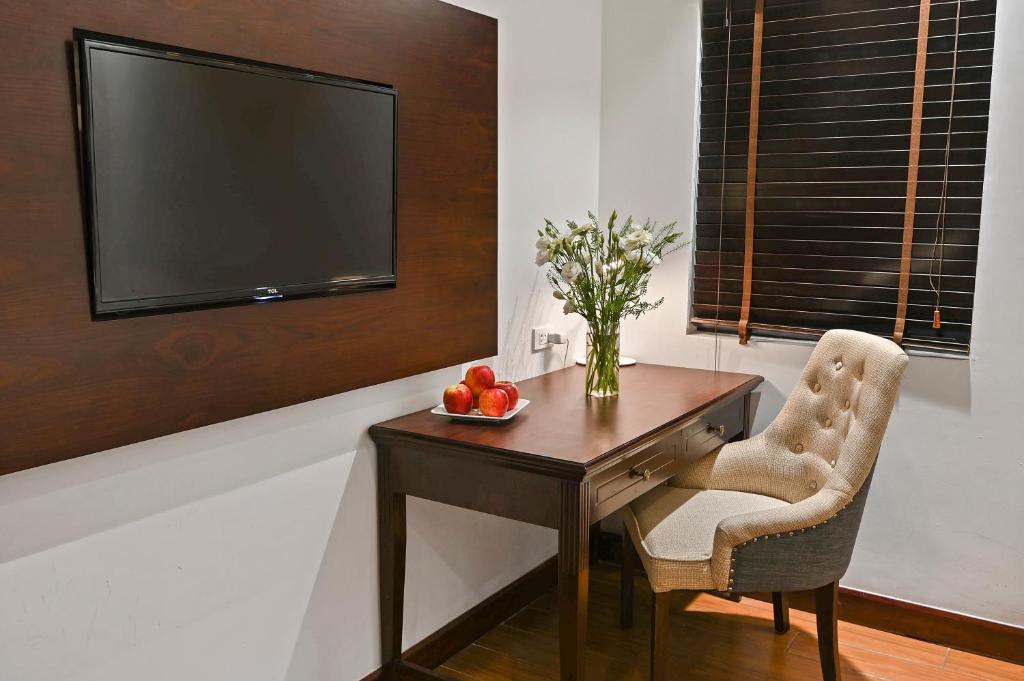 TV a/nebo společenská místnost v ubytování Bradi Gate- 22Land Residence Hotel