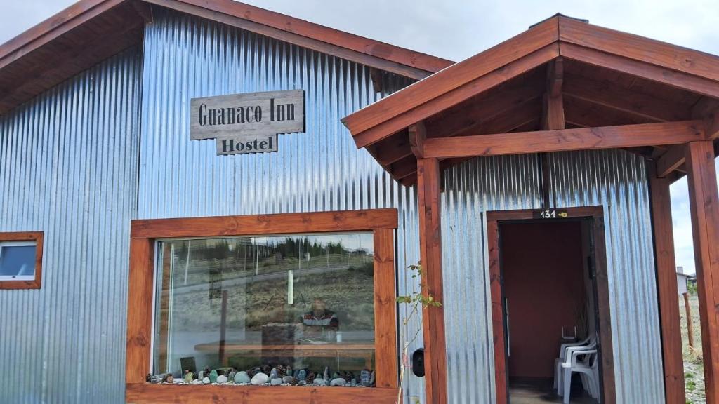 a building with a sign that reads heritage innoked at Guanaco Inn in El Calafate