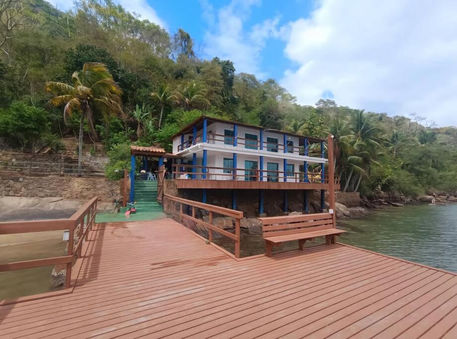 a house on a wooden dock on the water at Casa Paraíso Bananal - Iha Grande - Angra Dos Reis in Angra dos Reis