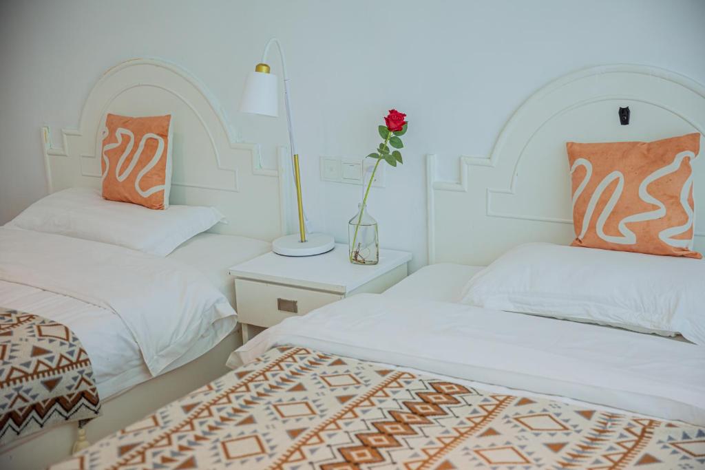 Postel nebo postele na pokoji v ubytování Lumingju Homestay