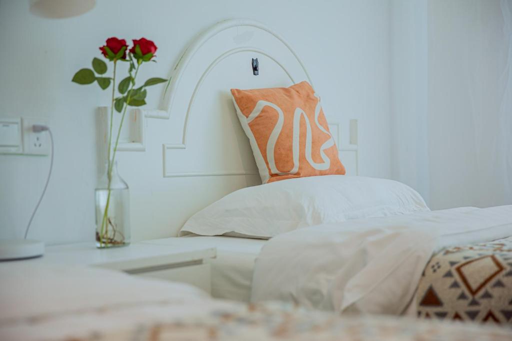 Postel nebo postele na pokoji v ubytování Lumingju Homestay