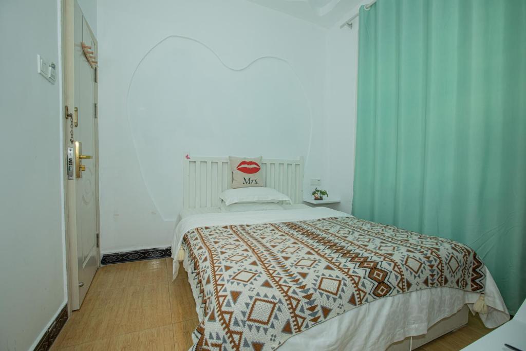 Postel nebo postele na pokoji v ubytování Lumingju Homestay