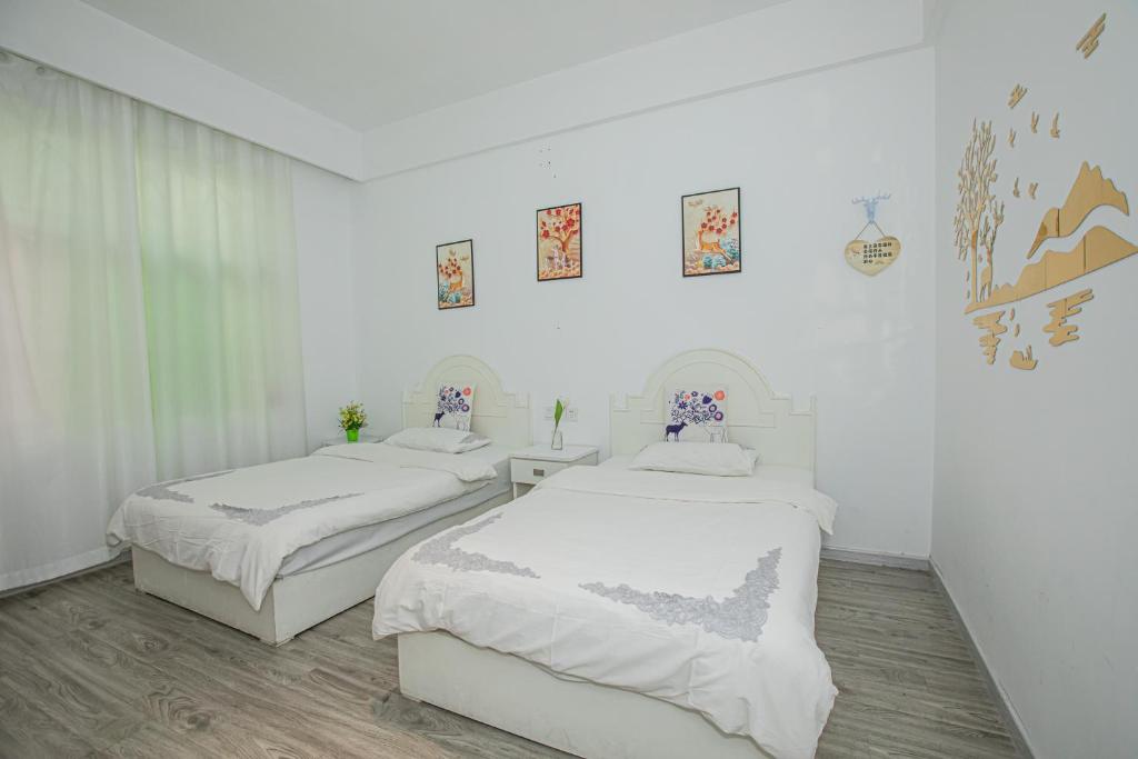 Postel nebo postele na pokoji v ubytování Lumingju Homestay