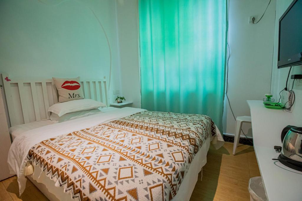Postel nebo postele na pokoji v ubytování Lumingju Homestay