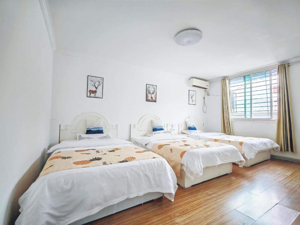 Postel nebo postele na pokoji v ubytování Lumingju Homestay