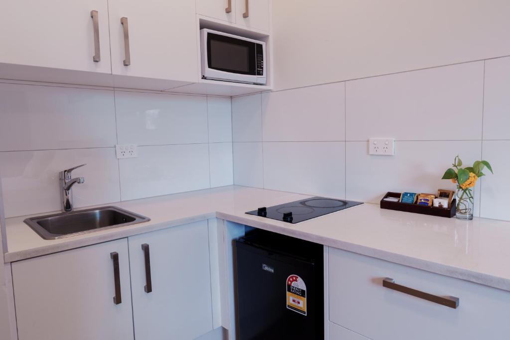Kuchyň nebo kuchyňský kout v ubytování Yates Park Motel