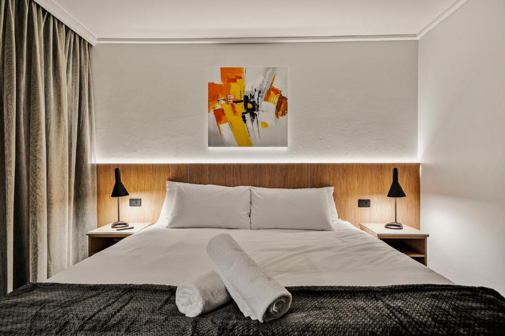 Postel nebo postele na pokoji v ubytování Prince of Wales Hotel