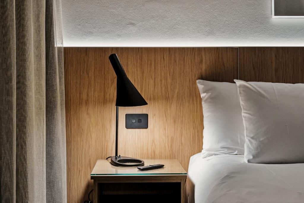 Postel nebo postele na pokoji v ubytování Prince of Wales Hotel