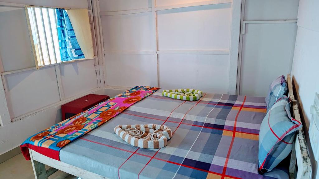 Postel nebo postele na pokoji v ubytování Shree Sai Beach Stay