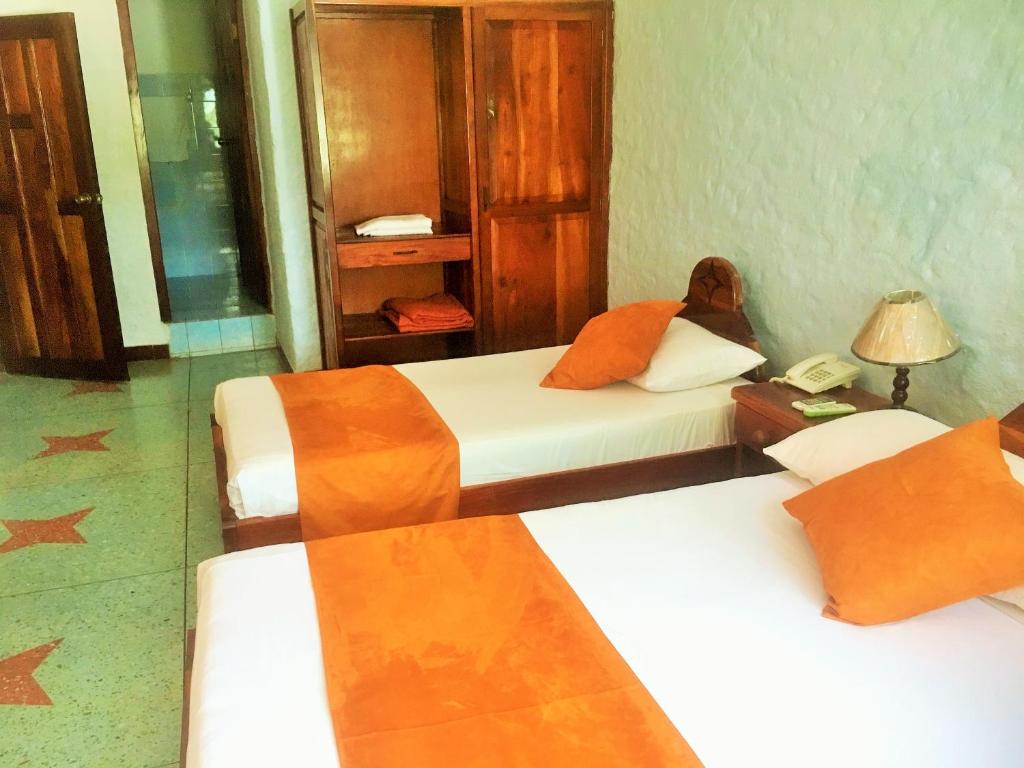 Postel nebo postele na pokoji v ubytování Hostal Estrella de Mar