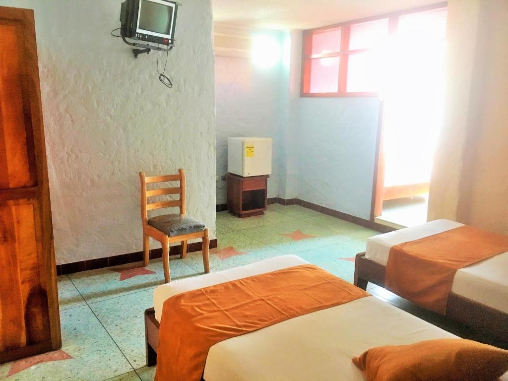Postel nebo postele na pokoji v ubytování Hostal Estrella de Mar