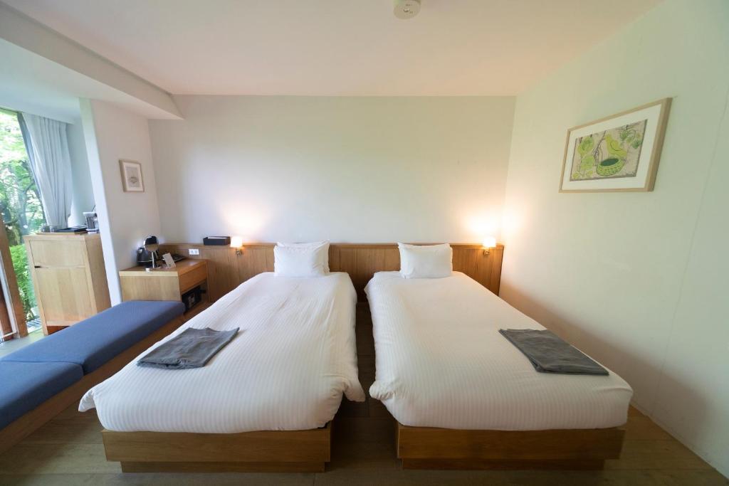 Postel nebo postele na pokoji v ubytování Hakone Retreat Före