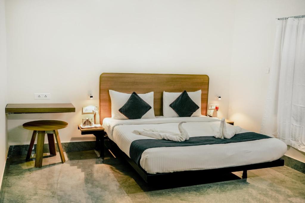 Postel nebo postele na pokoji v ubytování SM Residency