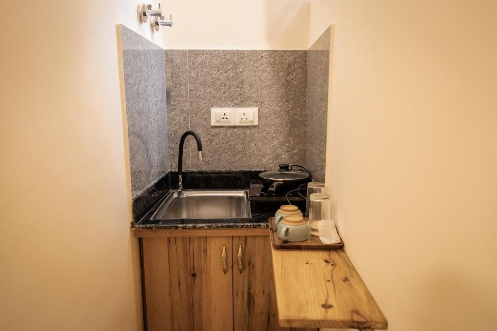 Kuchyň nebo kuchyňský kout v ubytování Sinpa Home Pilachhen