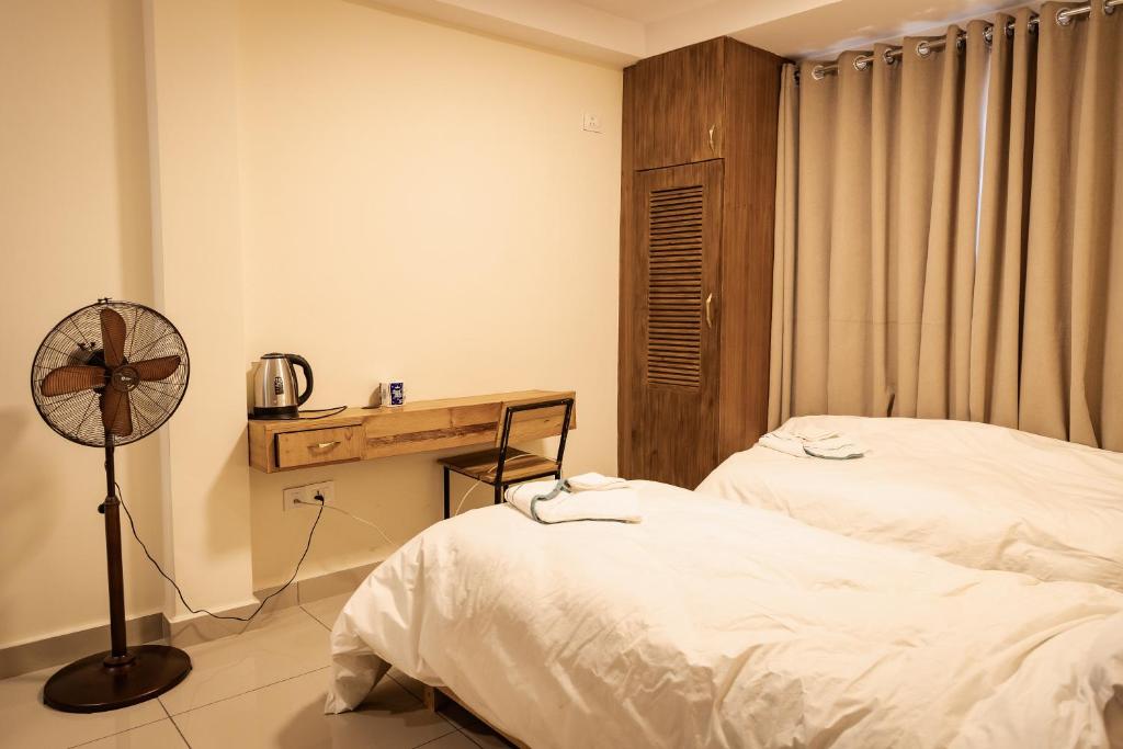 Postel nebo postele na pokoji v ubytování Sinpa Home Pilachhen