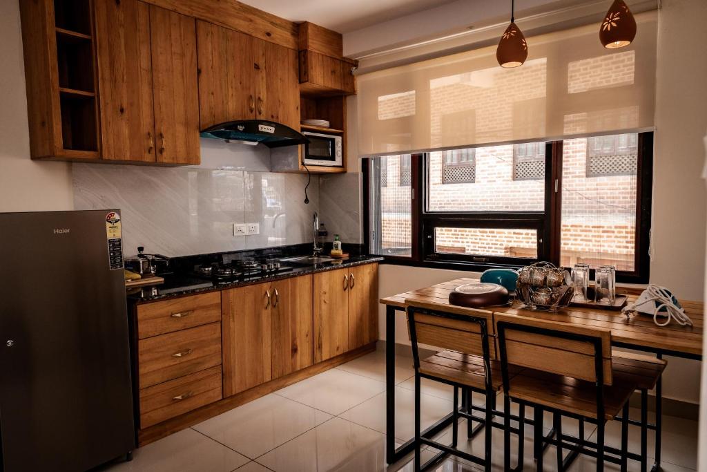 Kuchyň nebo kuchyňský kout v ubytování Sinpa Home Pilachhen