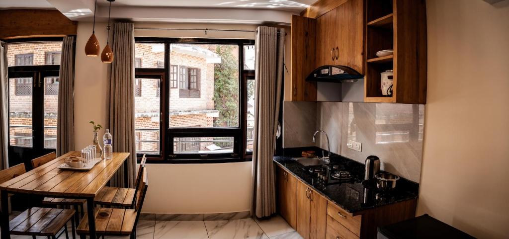 Kuchyň nebo kuchyňský kout v ubytování Sinpa Home Pilachhen