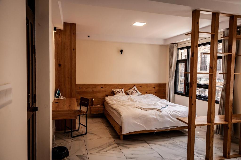 Postel nebo postele na pokoji v ubytování Sinpa Home Pilachhen
