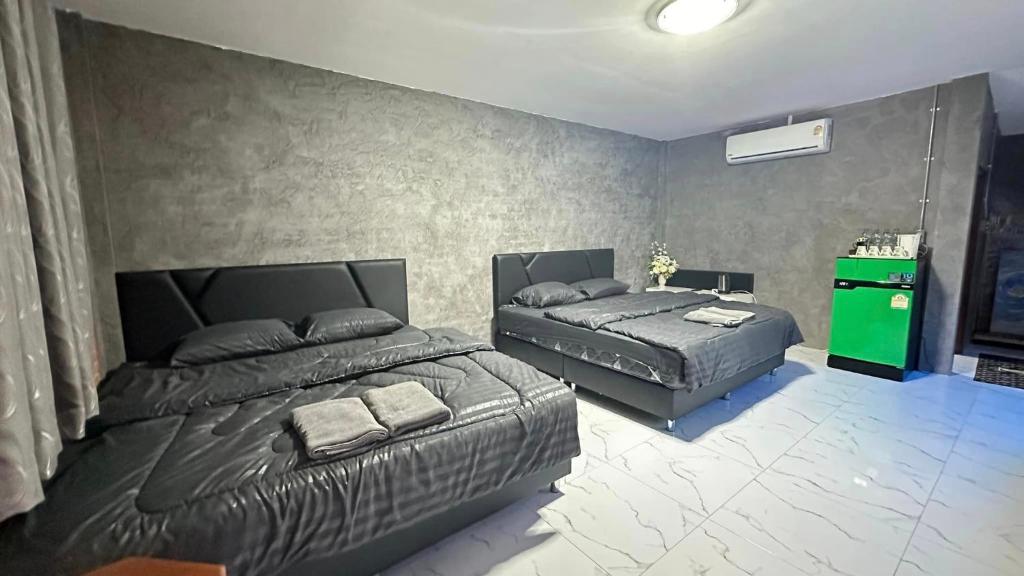 Postel nebo postele na pokoji v ubytování บ้านภทรพรรณ ขุนยวม แม่ฮ่องสอน PATARAPHAN HOUSE, Khunyuam, Maehongson, Thailand