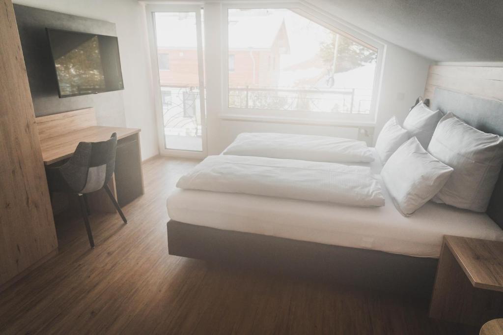 Postel nebo postele na pokoji v ubytování Hotel verWeiler
