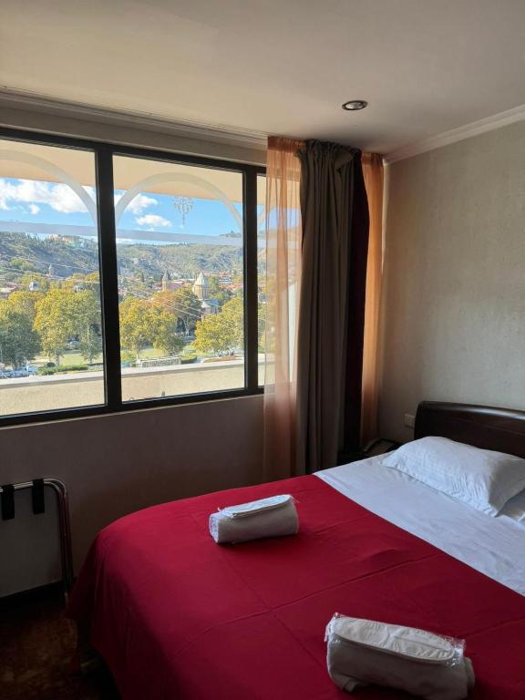 Postel nebo postele na pokoji v ubytování Hotel Rike park