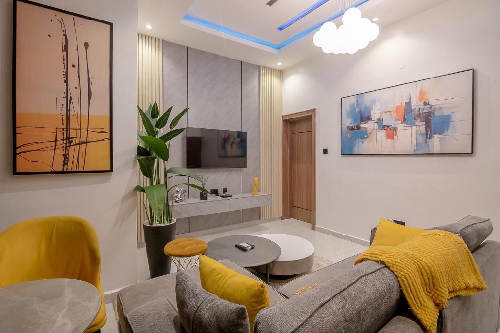 TV a/nebo společenská místnost v ubytování One90 Apartment