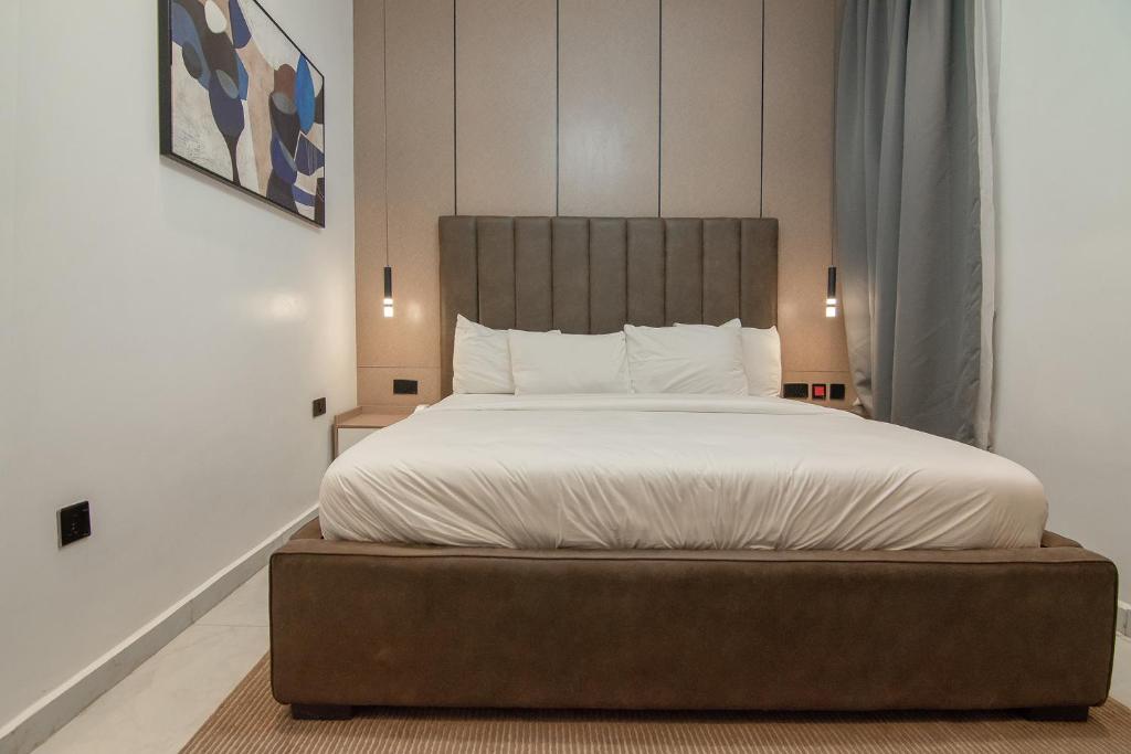 Postel nebo postele na pokoji v ubytování One90 Apartment