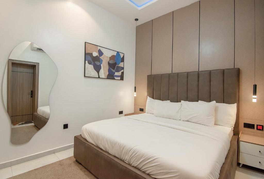 Postel nebo postele na pokoji v ubytování One90 Apartment