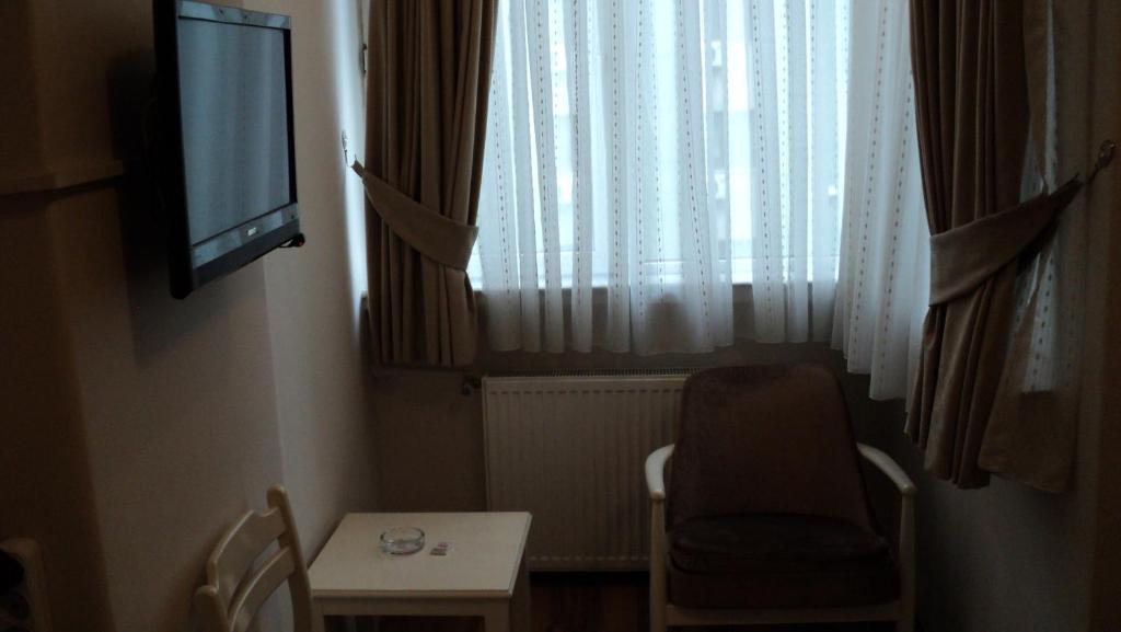 TV a/nebo společenská místnost v ubytování Tac Hotel