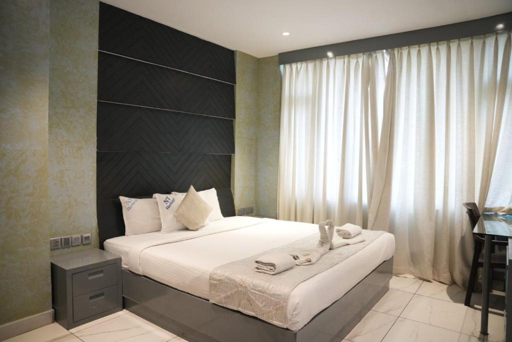Postel nebo postele na pokoji v ubytování NT Hotels and Resorts Akridha