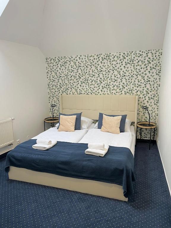 Postel nebo postele na pokoji v ubytování Hotel Apollon