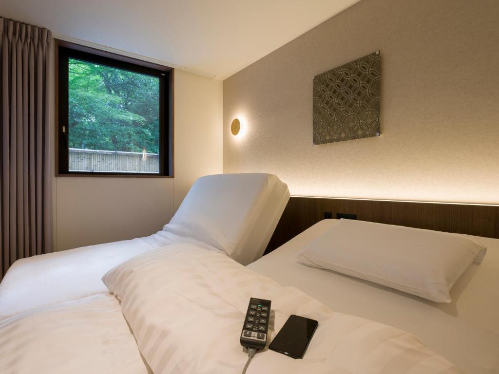 Postel nebo postele na pokoji v ubytování Rakuten STAY TERRACE Hakone Kowakudani