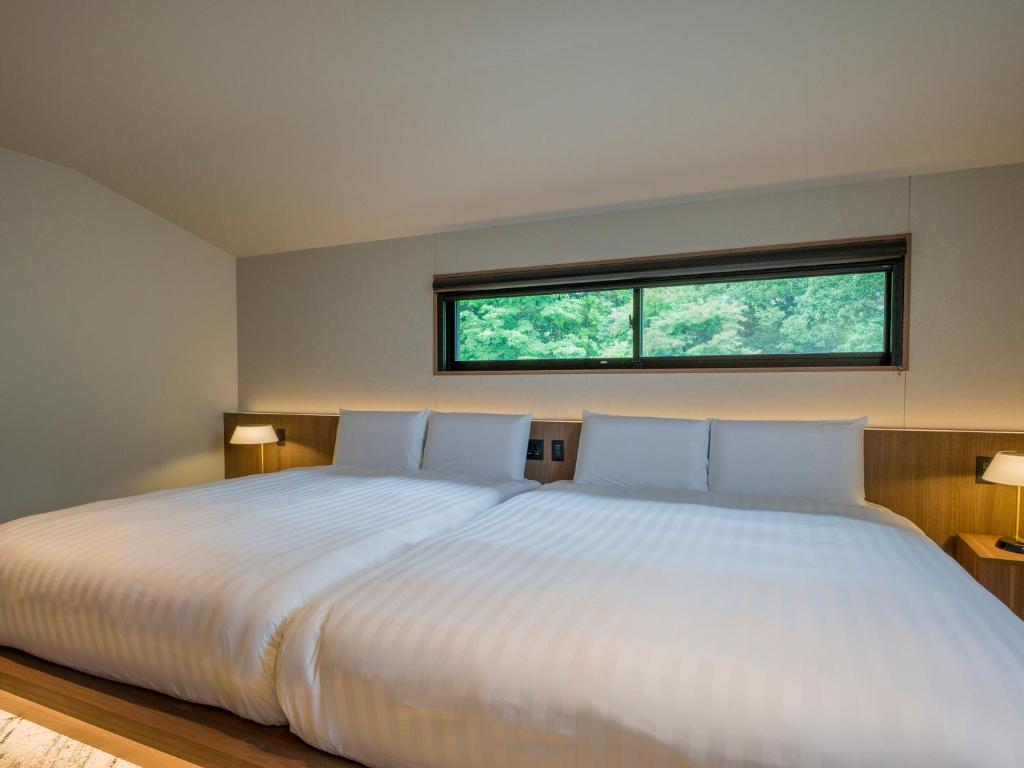 Postel nebo postele na pokoji v ubytování Rakuten STAY TERRACE Hakone Kowakudani