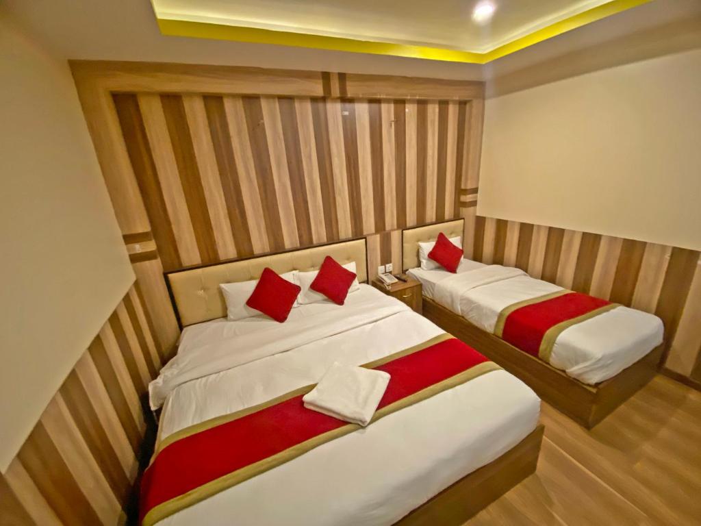 Postel nebo postele na pokoji v ubytování Hotel Airport Holiday