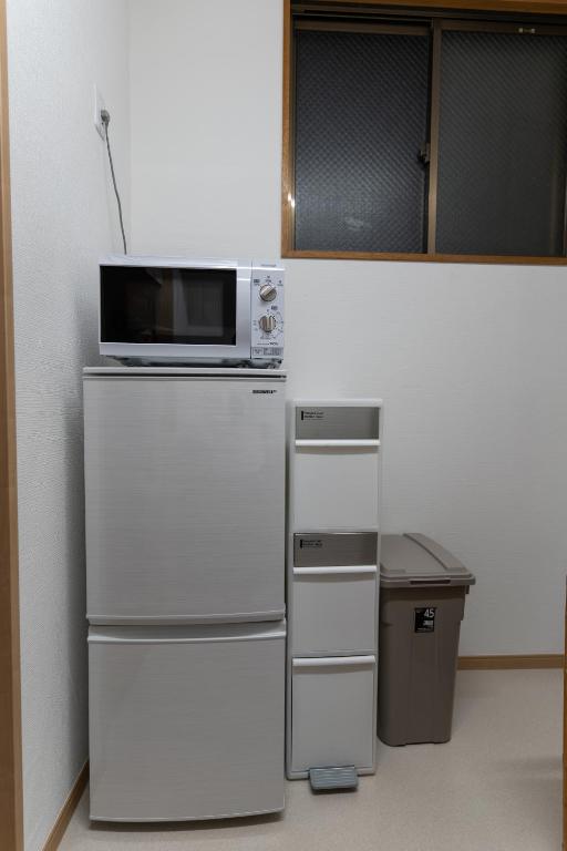 Kuchyň nebo kuchyňský kout v ubytování 大吉屋 ワンフロア貸切旅館名古屋駅圏内