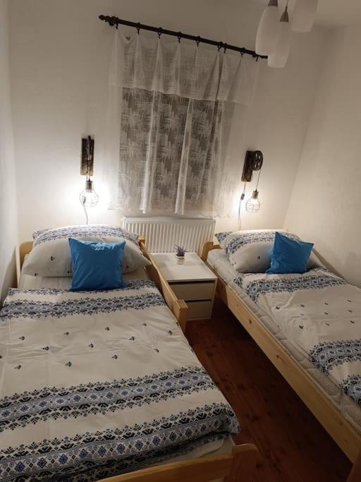 Postel nebo postele na pokoji v ubytování Ubytování v tichu u Českého Krumlova
